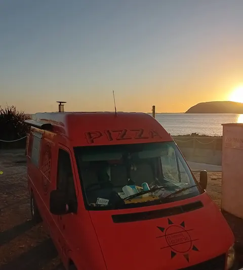 Sunset over the estuary at Ferryside, Ferdie parked on the sea front