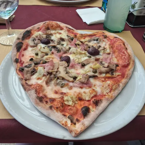 A heart shaped pizza on a plate