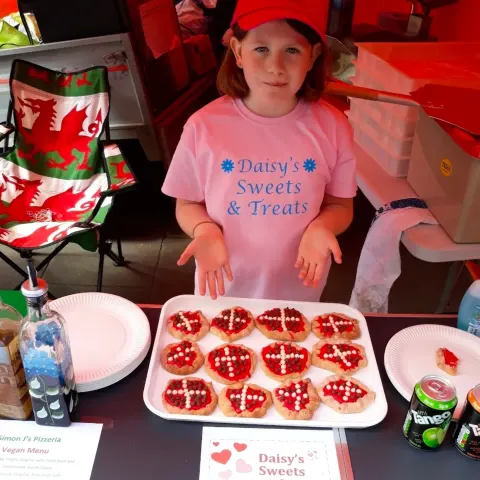 Daisy as a little girl with her Daisy's Sweets & Treats table